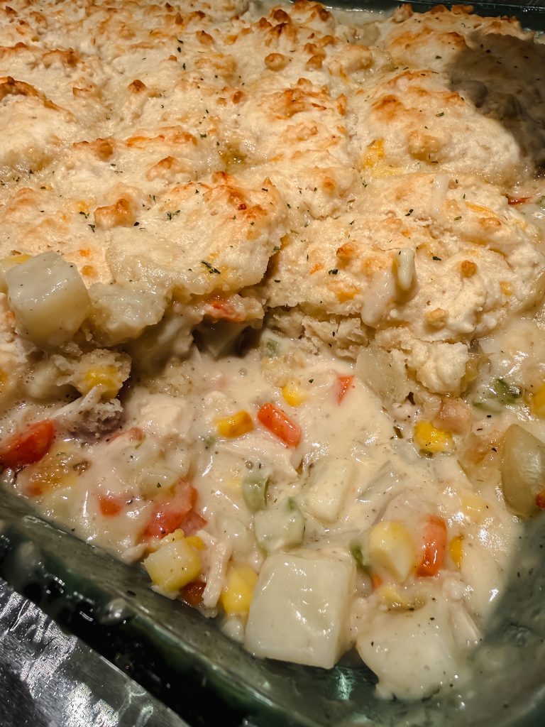 Cheddar Bay biscuit turkey pot pie with creamy filling and fluffy biscuit topping in a glass baking dish